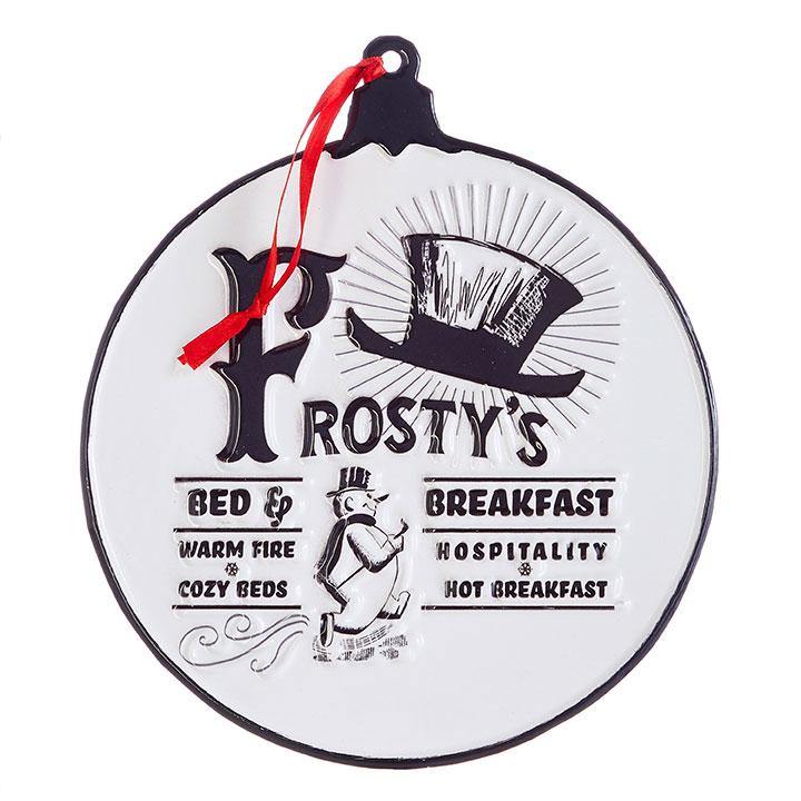 A metal ornament in the shape of a Christmas ball ornament - white with black outline and top. "Frosty's" is written in large type at the top with top hat artwork. The full ornament reads Frosty's Bed and Breakfast. Warm Fire and Cozy Beds. Hospitality and Hot Breakfast.